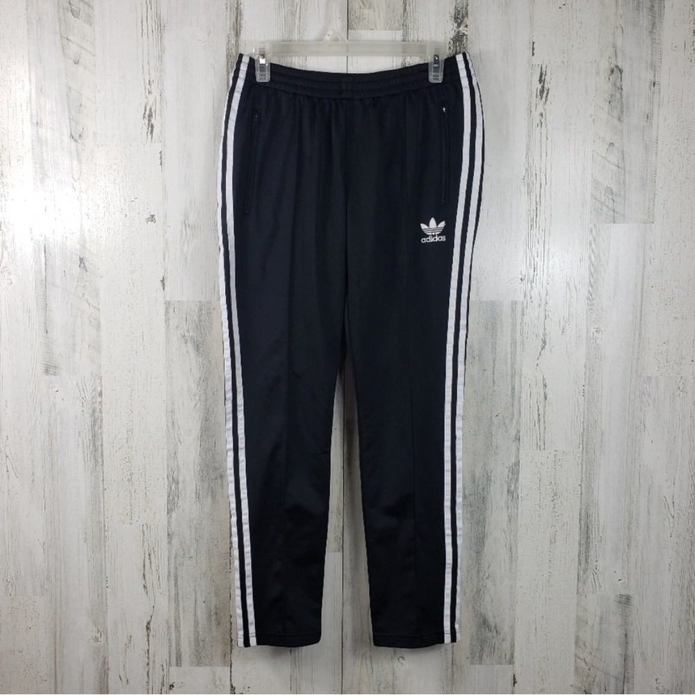 Adidas black and white pants with zip ankles and pocket gender neutral size M